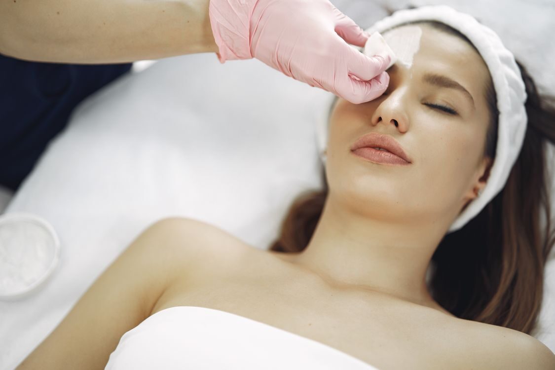 Woman receiving a facial skincare treatment at a med spa