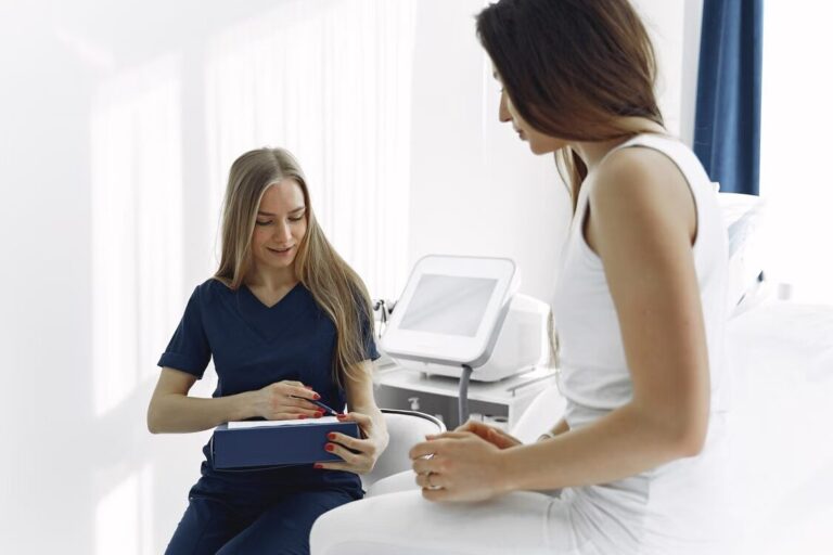 Med spa provider consulting with a patient during a treatment appointment